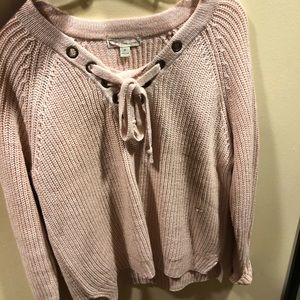 V-neck cross from sweater